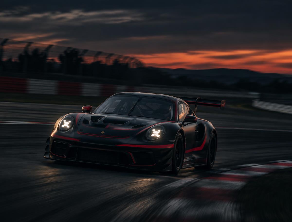 GT3 race car cornering on a circuit at dusk with motion blur